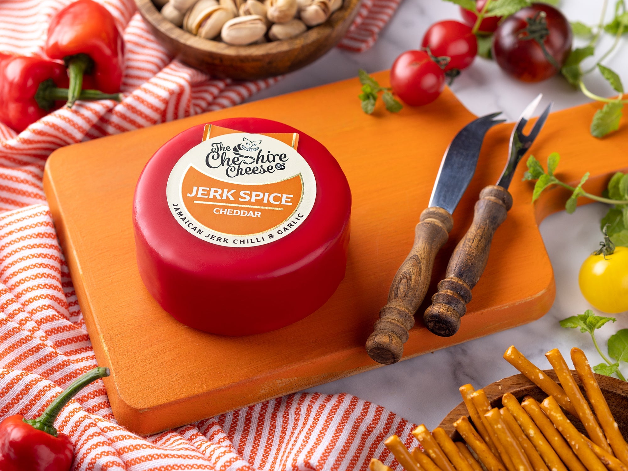 Jerk Spice Chilli and Garlic Cheddar waxed cheese truckle
