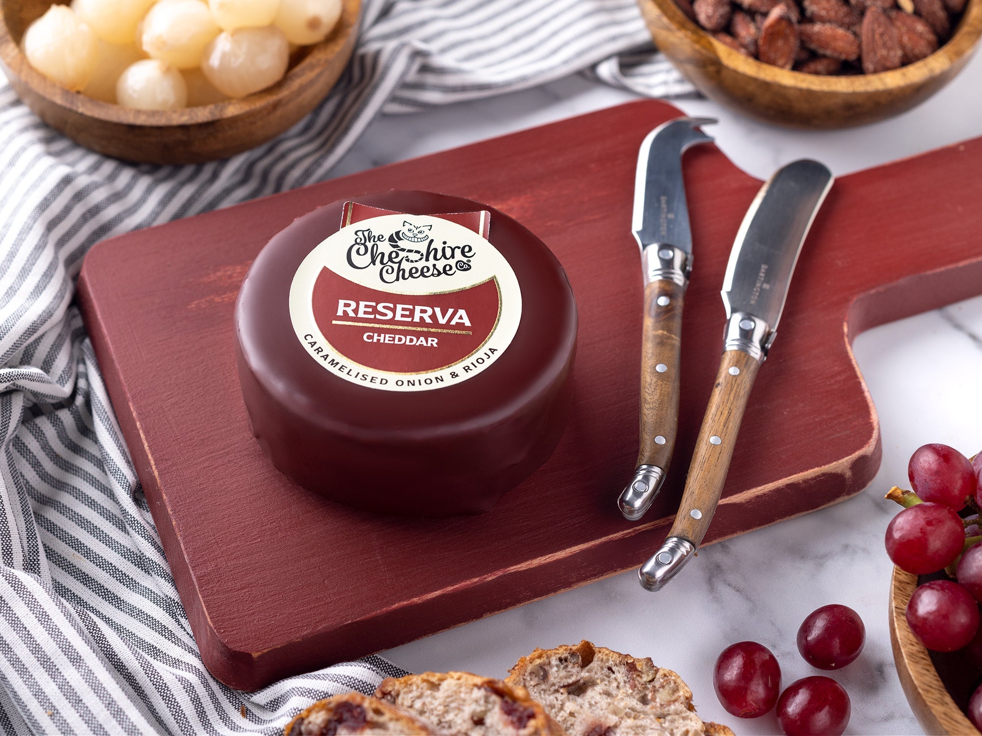 Reserva Caramelised Onion and Rioja Cheddar waxed cheese truckle