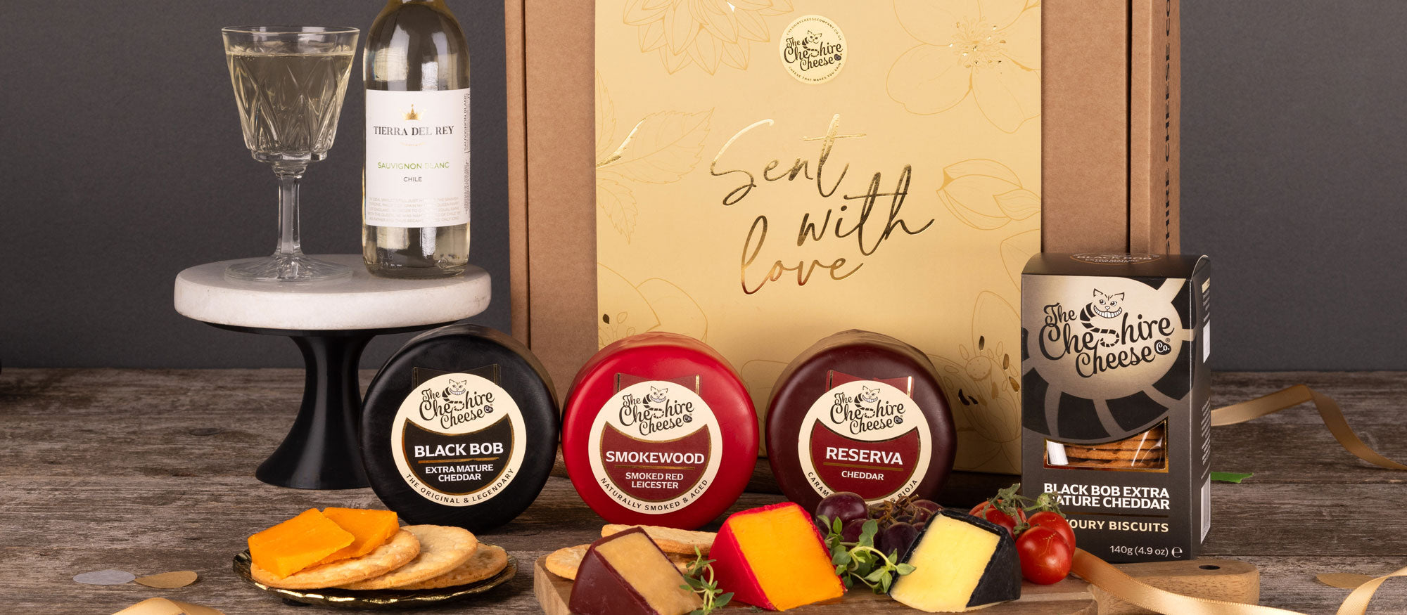 Anniversary cheese hamper with waxed truckles and a bottle of wine