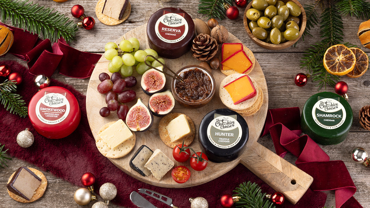 Waxed Cheeses on a Christmas Cheeseboard Table Spread