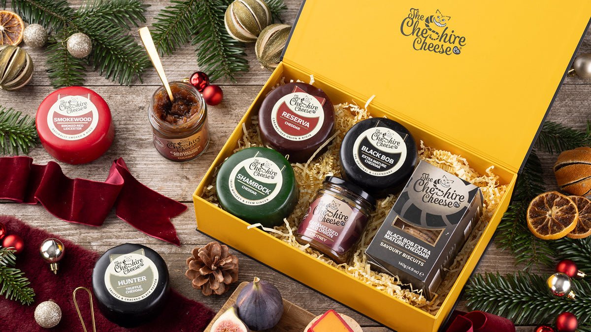 Open cheese gift on table shot