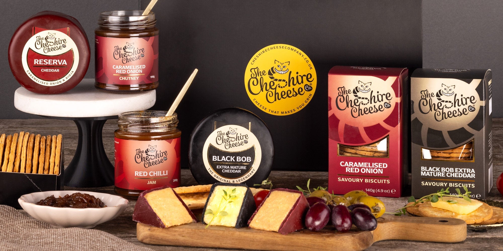 Cheese and biscuit hamper with waxed truckles and biscuits for cheese